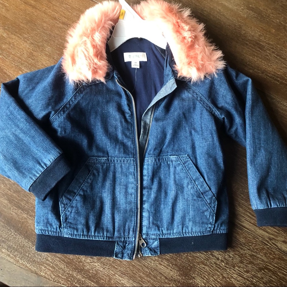 Girls insulated denim jacket with fuzzy collar.